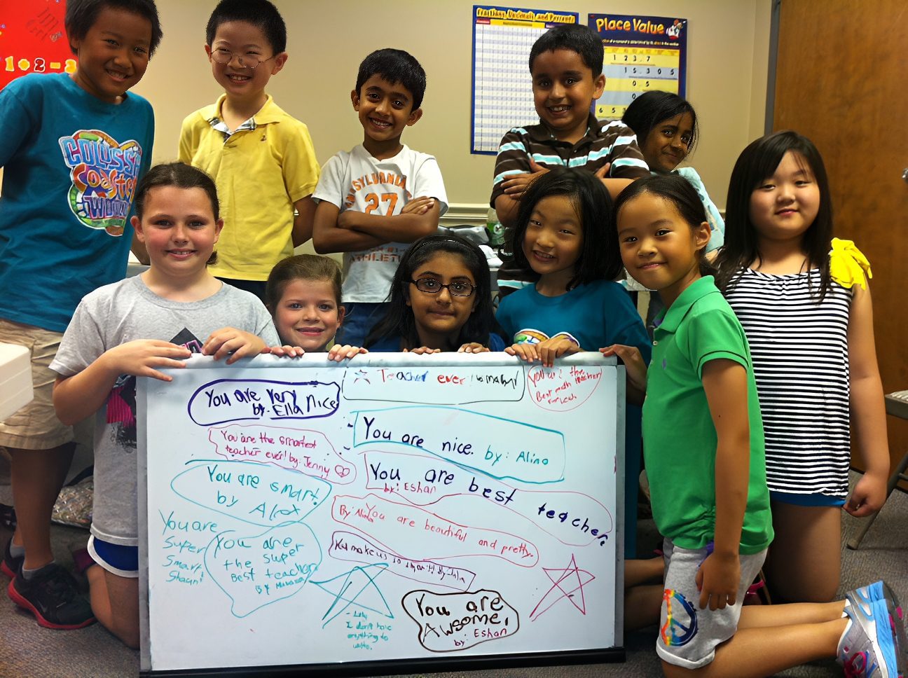 Group of kids with a message board.